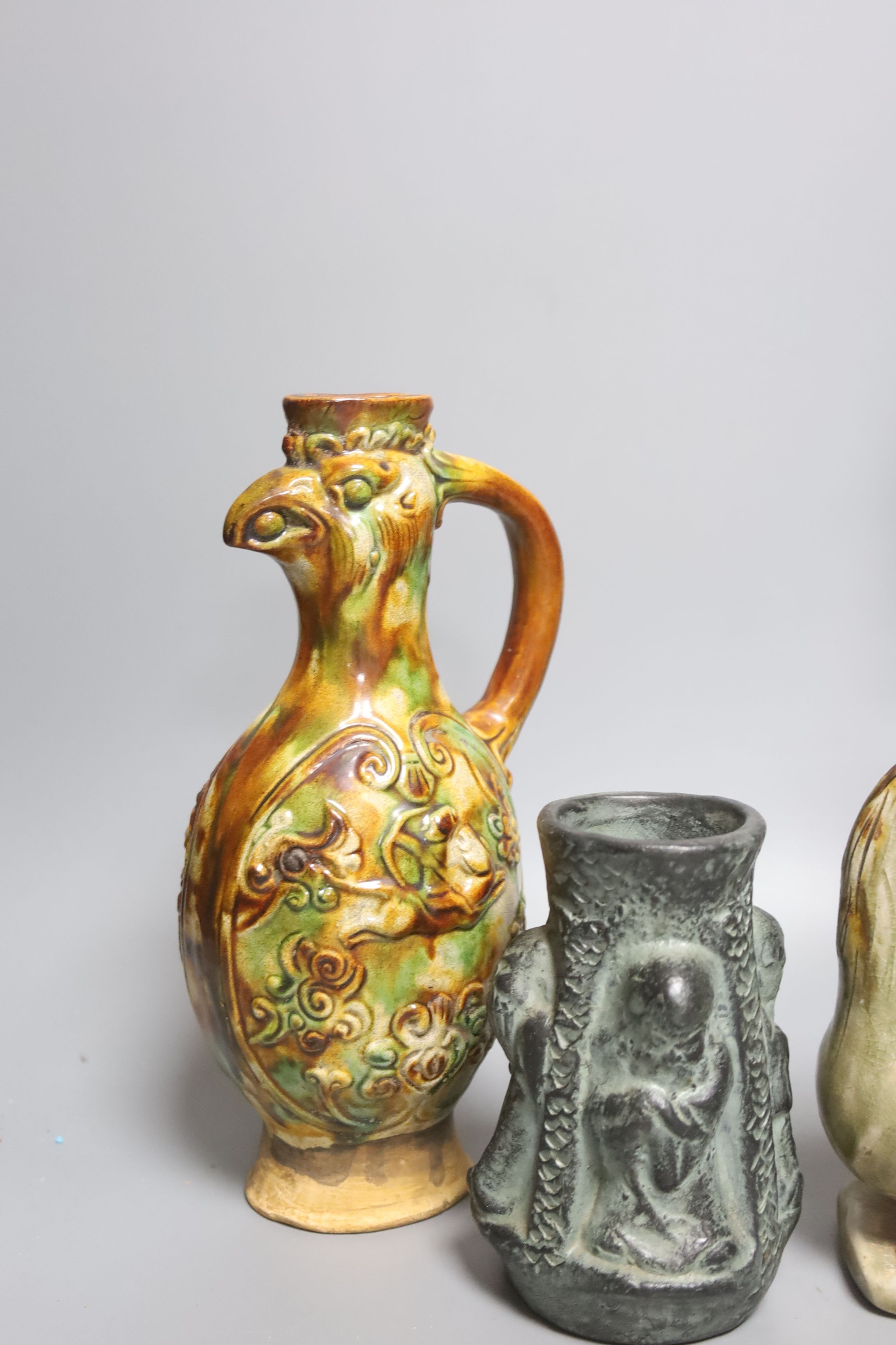 A Chinese Tang style sancai figure of a lady, a similar phoenix head ewer, a Yue type oil lamp and another vessel (4)